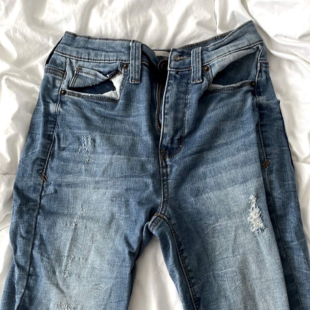 Washed out blue jeans small rips